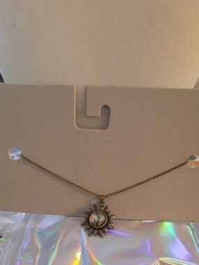 Urban Outfitters Gold Sunburst Necklace with Iridescent Center